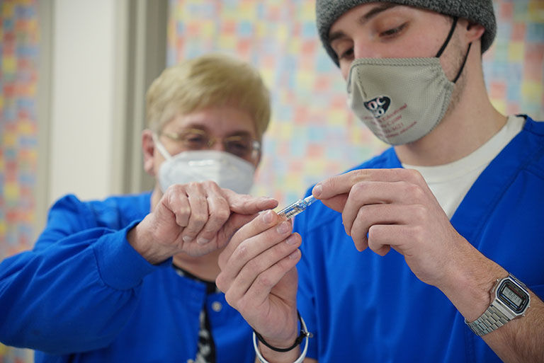 Nursing student with teacher